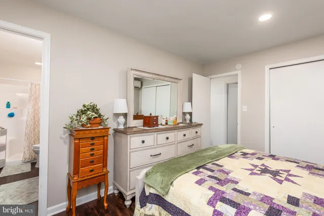 a bed room with a bed and a television