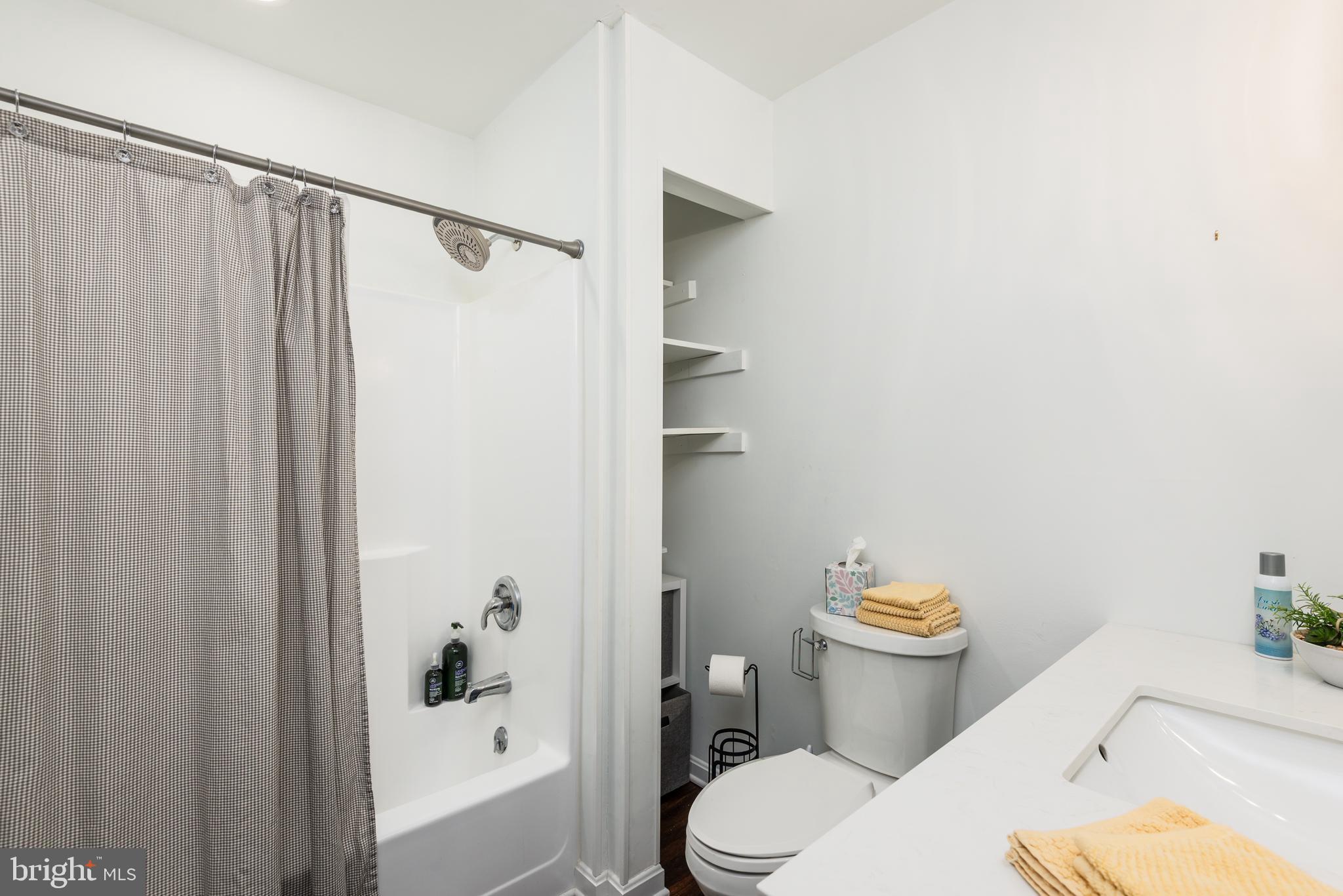 505 Maryland Avenue Ridgely, MD 21660 - Photo 19 of 23 a white toilet sitting next to a bathroom sink