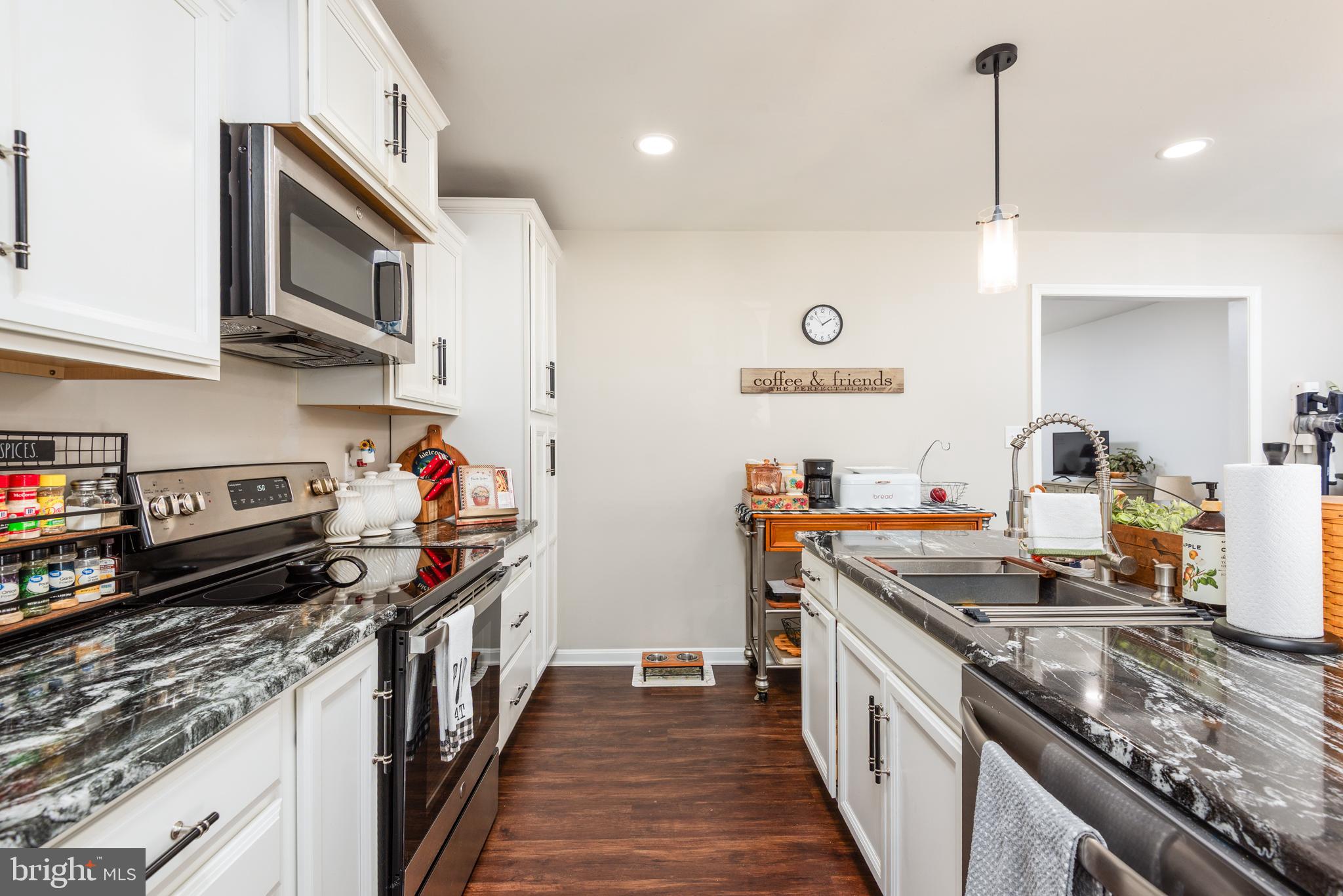 505 Maryland Avenue Ridgely, MD 21660 - Photo 9 of 23 a kitchen with stainless steel appliances granite countertop a stove and a sink