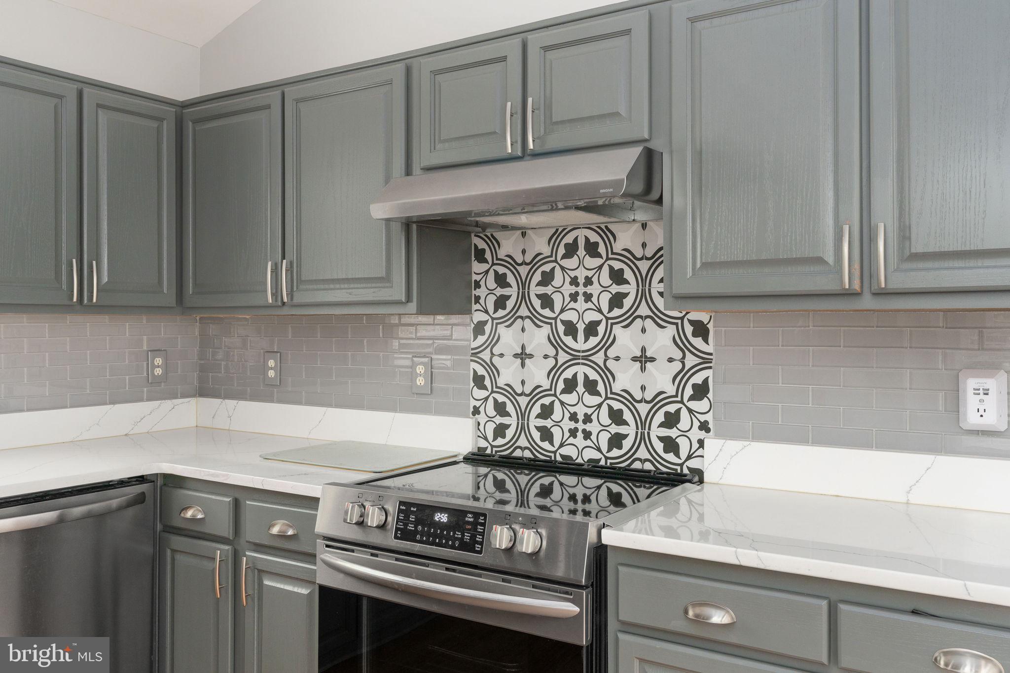 8009 Burrell Road Fredericksburg, VA 22407 - Photo 9 of 66 Sleek kitchen with stylish backsplash.