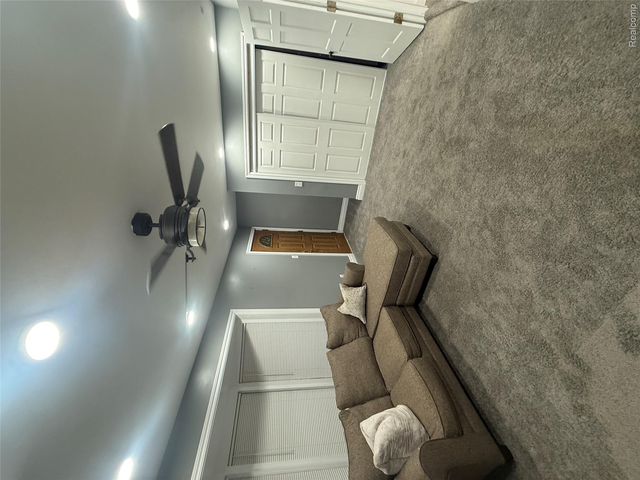 44862 Willis Road Belleville, MI 48111 - Photo 7 of 14 Living area with ceiling fan, carpet, and recessed lighting