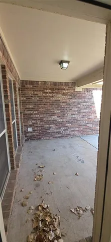 a view of a backyard with wooden fence