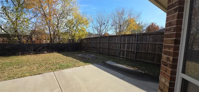 a view of backyard and tree