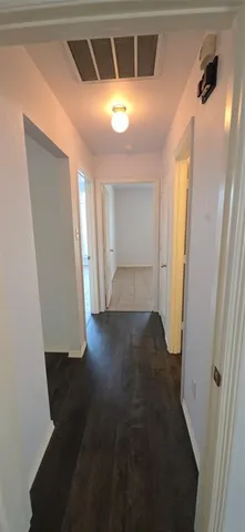 a bathroom with a sink toilet a mirror and vanity