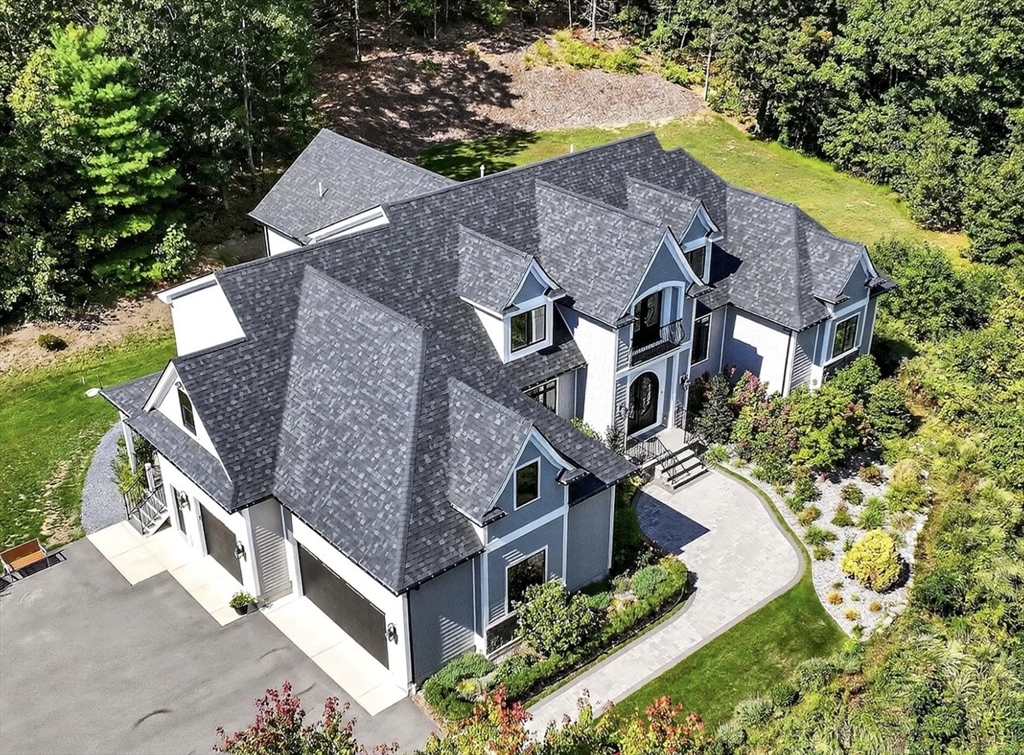 18 Keeney Pond Road Norfolk, MA 02056 - Photo 1 of 42 an aerial view of a house with a yard