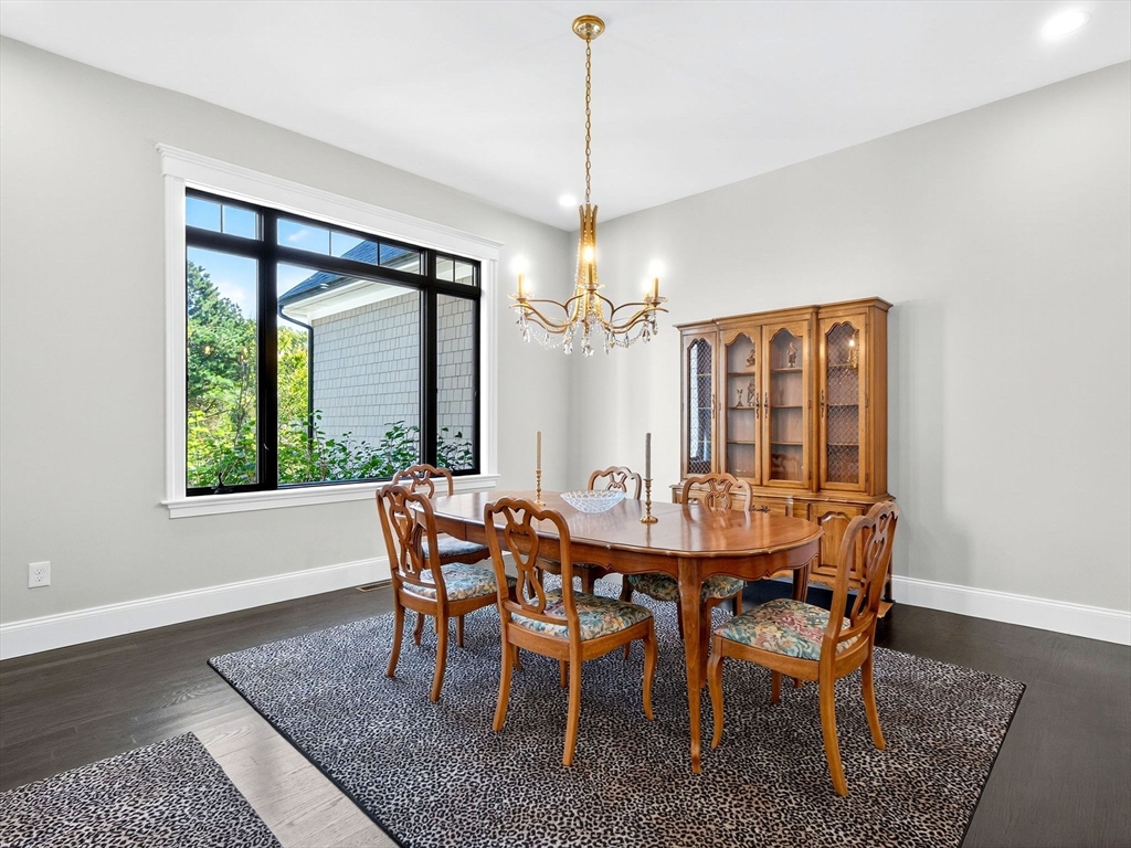 18 Keeney Pond Road Norfolk, MA 02056 - Photo 14 of 42 a view of a dining room with furniture window and wooden floor