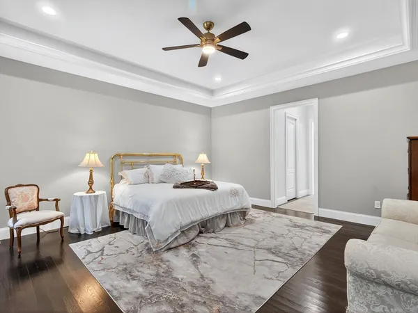 a bedroom with a bed and a chair