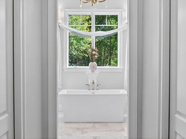 a bathroom with a sink and a window