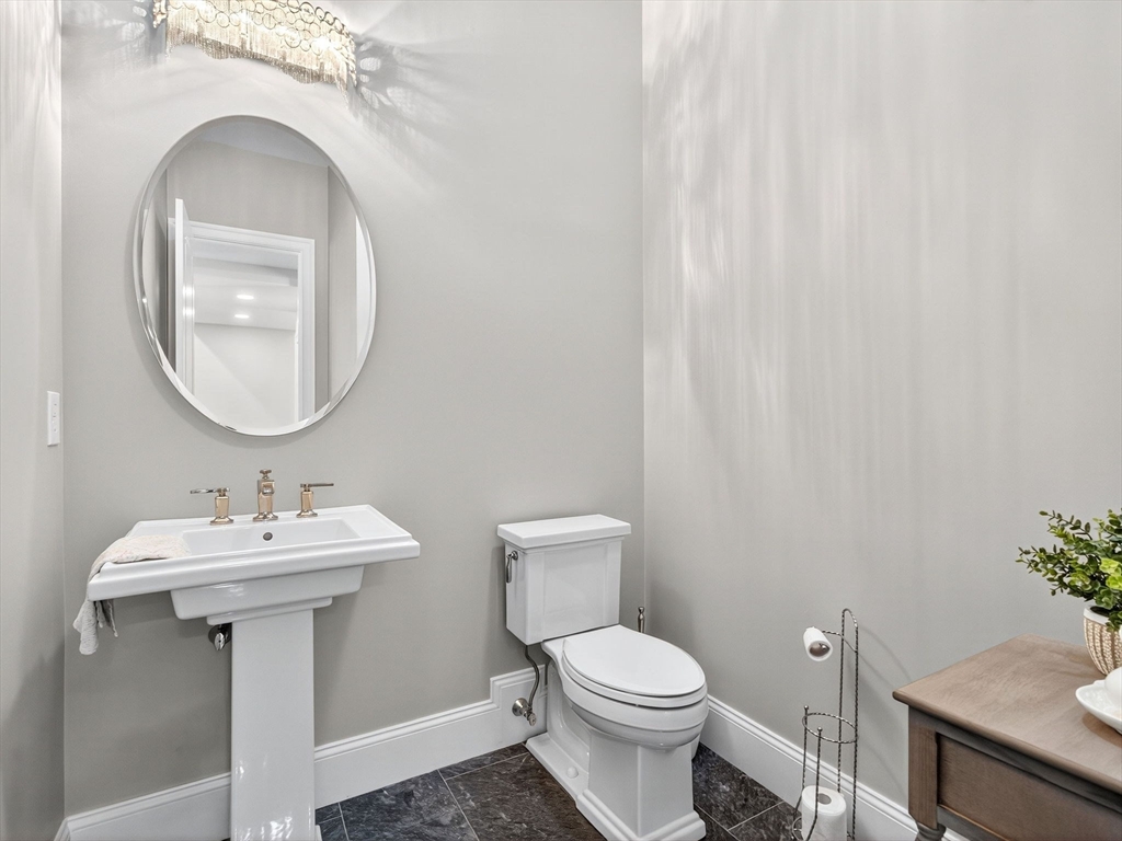 18 Keeney Pond Road Norfolk, MA 02056 - Photo 24 of 42 a bathroom with a sink mirror and toilet