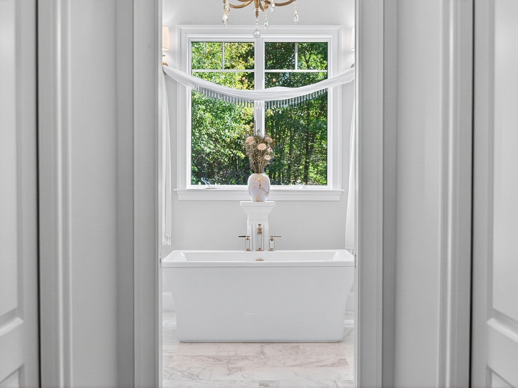 18 Keeney Pond Road Norfolk, MA 02056 - Photo 25 of 42 a bathroom with a sink and a window