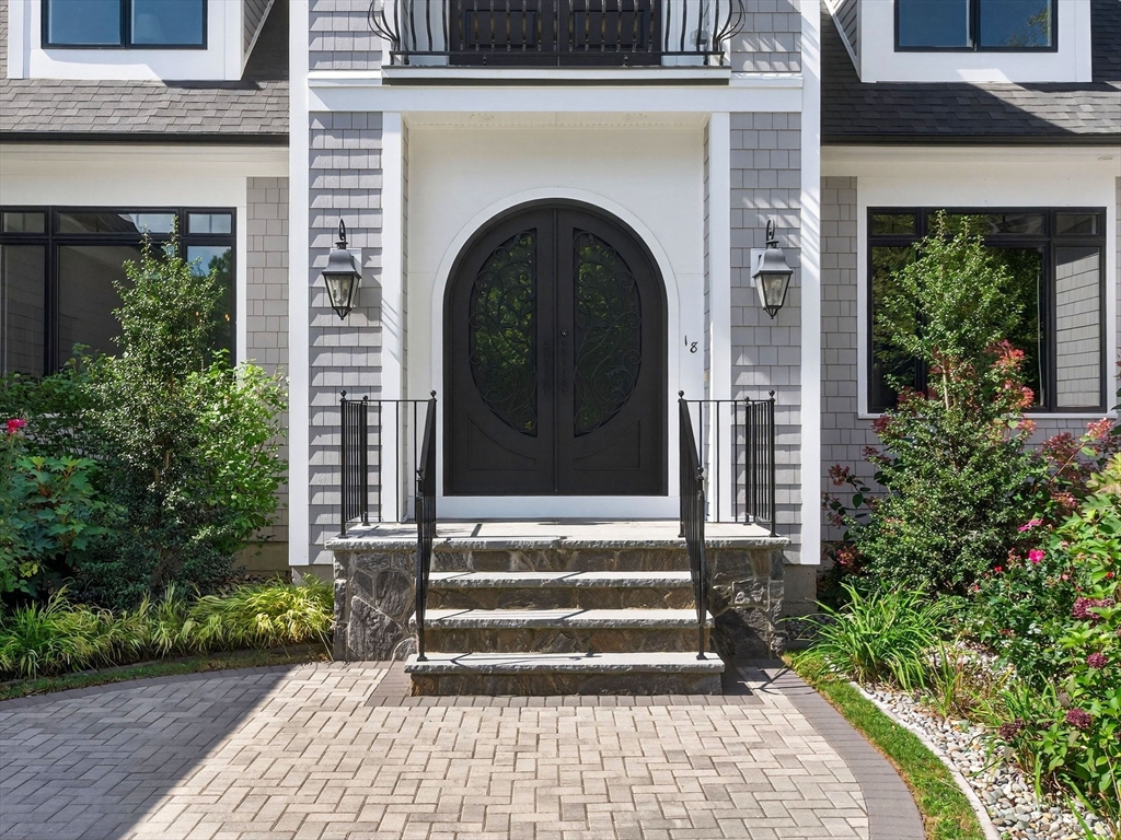 18 Keeney Pond Road Norfolk, MA 02056 - Photo 3 of 42 a front view of a house with a garden
