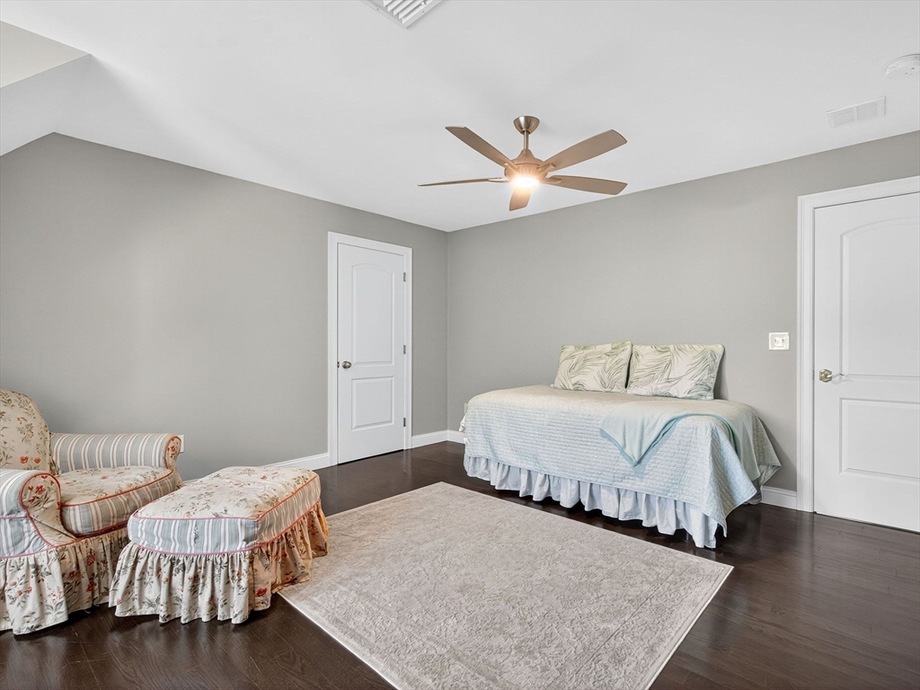 18 Keeney Pond Road Norfolk, MA 02056 - Photo 31 of 42 a bedroom with a bed and a ceiling fan