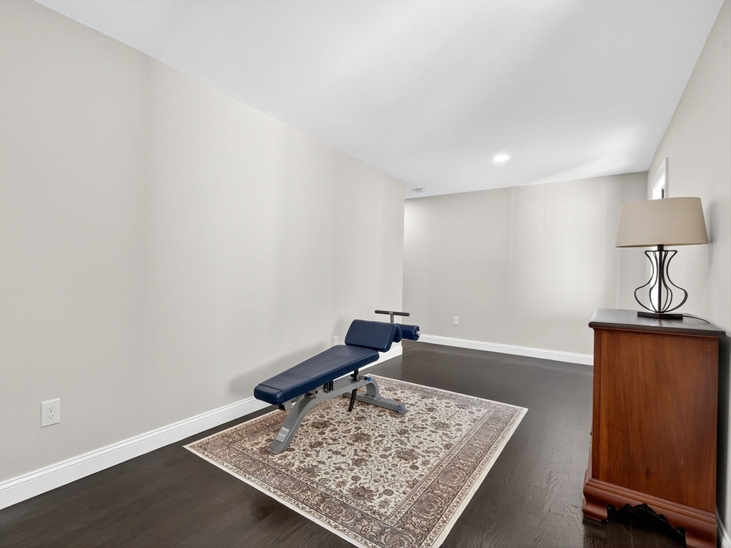 18 Keeney Pond Road Norfolk, MA 02056 - Photo 32 of 42 a view of a hallway with a couch