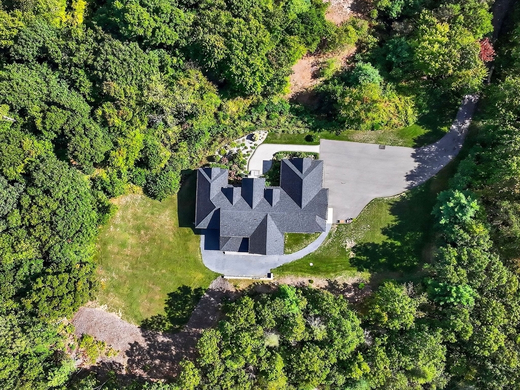 18 Keeney Pond Road Norfolk, MA 02056 - Photo 40 of 42 a view of a house with a yard and sitting area
