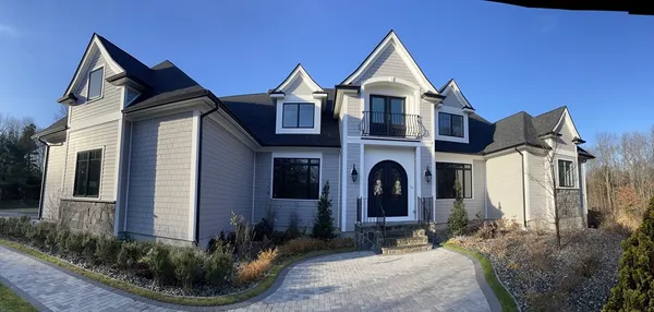 a front view of a house with a yard
