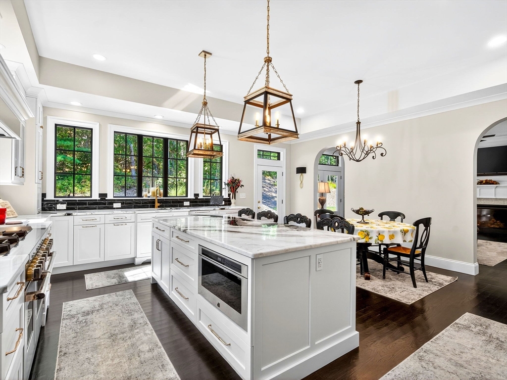 18 Keeney Pond Road Norfolk, MA 02056 - Photo 9 of 42 a kitchen with a stove and a view of living room
