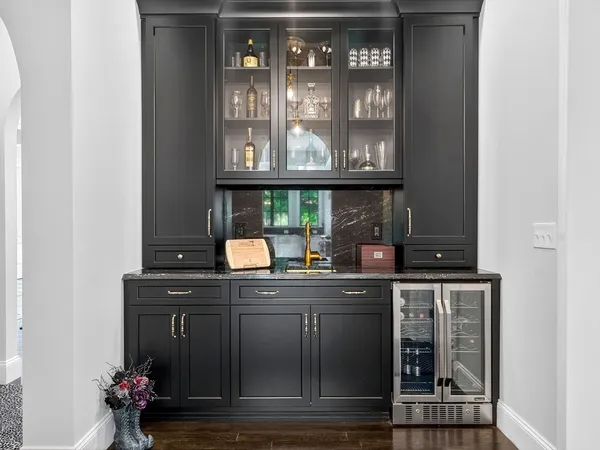 a kitchen with a sink and cabinets