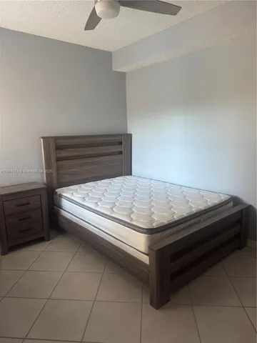 a bedroom with a bed and a cabinets