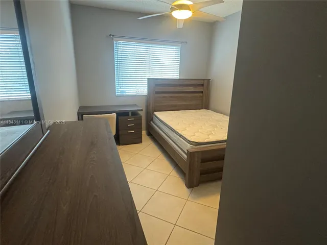 a bathroom with a bathtub and a window