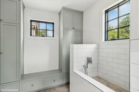 a bathroom with a bathtub and shower