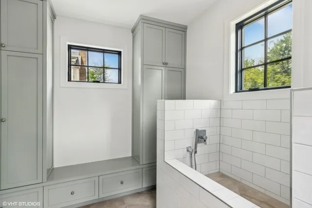 a bathroom with a bathtub and shower