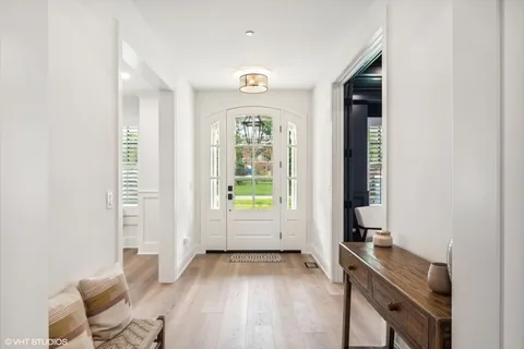 a view of room with window and wooden floor