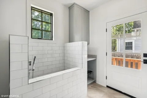 a bathroom with a bathtub and shower
