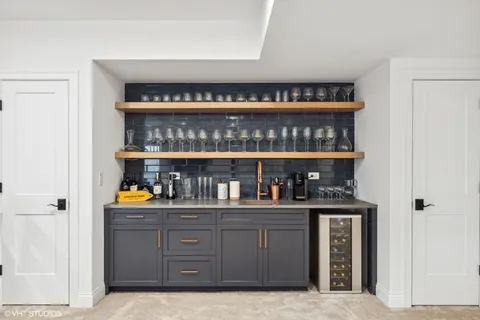a kitchen with refrigerator and cabinets