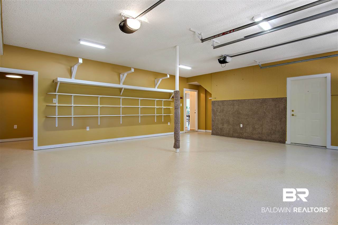 3136 Cumberland Road Theodore, AL 36582 - Photo 42 of 50 Double car garage with coating on the floor.