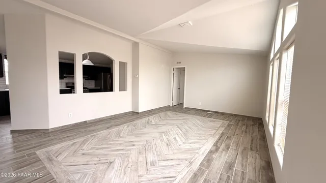a view of a livingroom with wooden floor