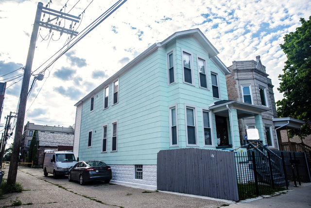 Undisclosed Address Chicago, IL 60644 - Photo 1 of 7 a car parked in front of a house