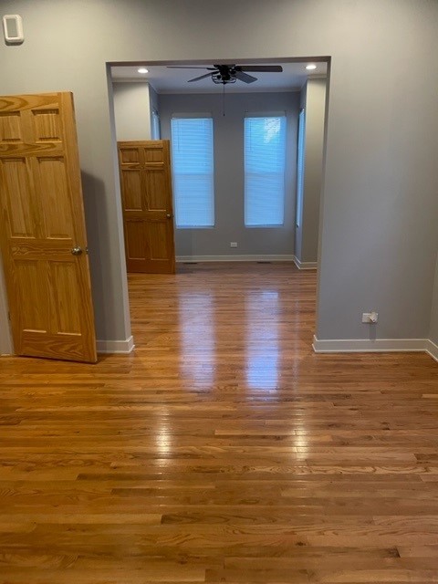 Undisclosed Address Chicago, IL 60644 - Photo 4 of 7 a view of room with window and wooden floor