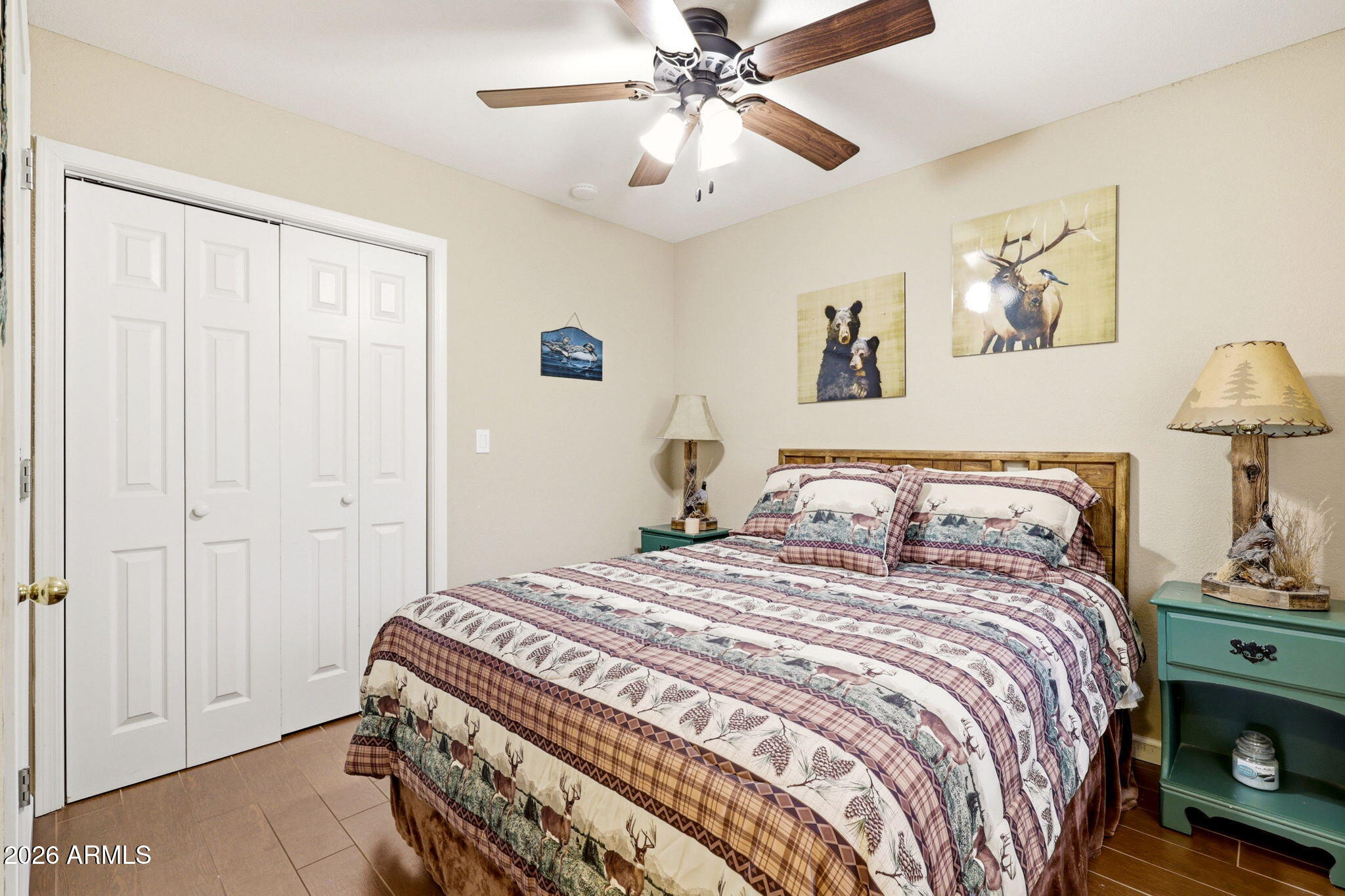 2112 Fishermans Road Overgaard, AZ 85933 - Photo 7 of 18 a bedroom with a bed and a chandelier