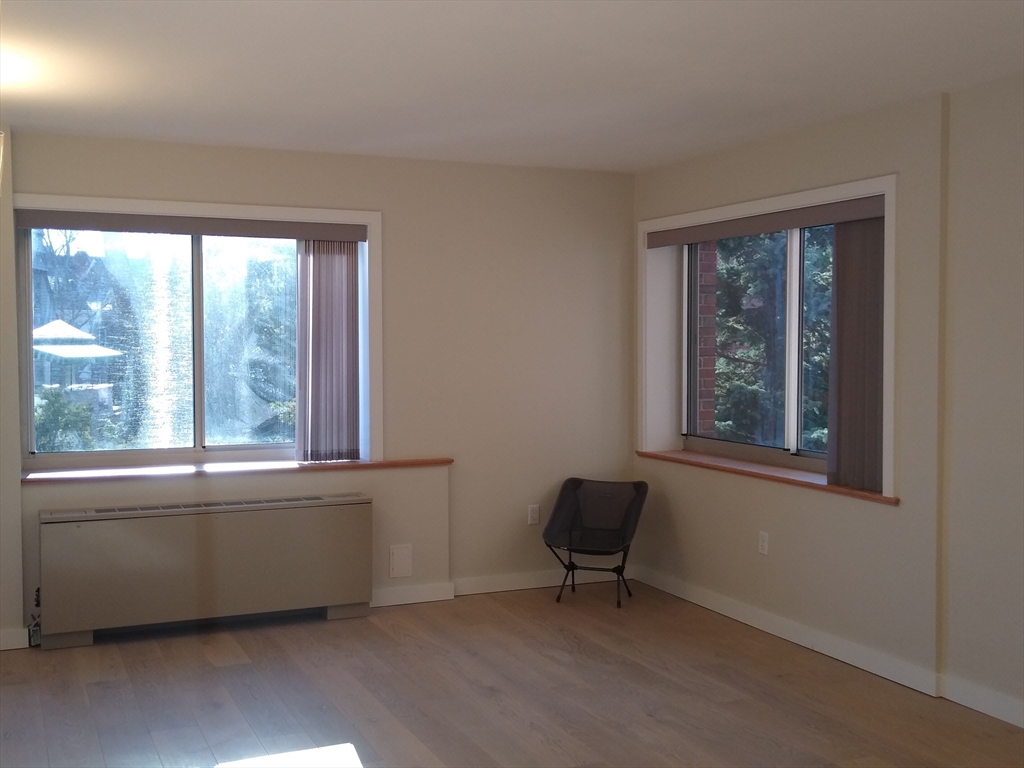 a room with a window and a chair