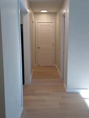 a view of hallway with closet