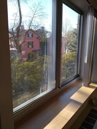 a view of a room with a large window