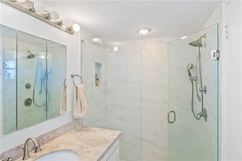 a bathroom with a sink and shower