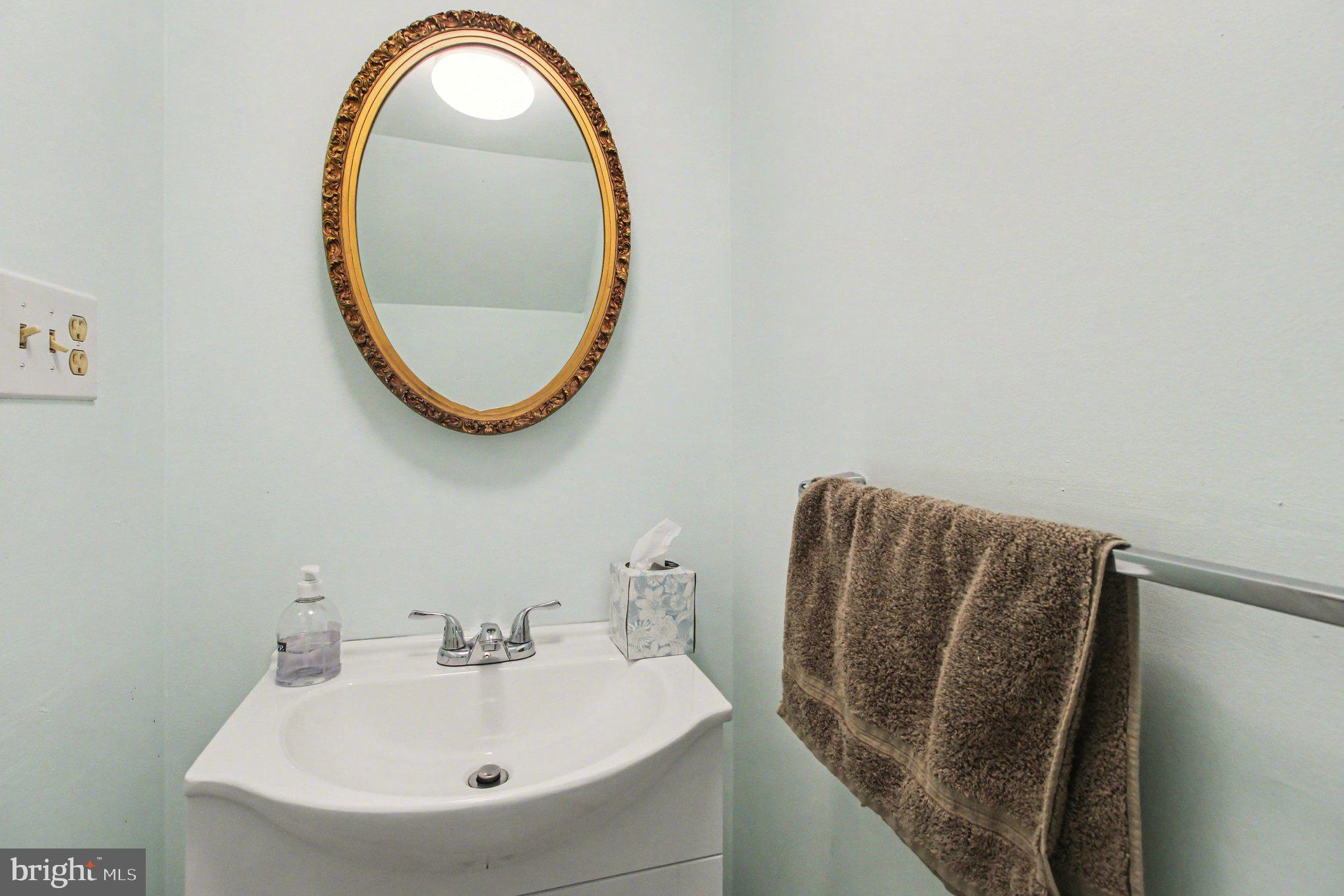 70 Rittenhouse Drive Willingboro, NJ 08046 - Photo 14 of 25 a bathroom with a sink and a mirror