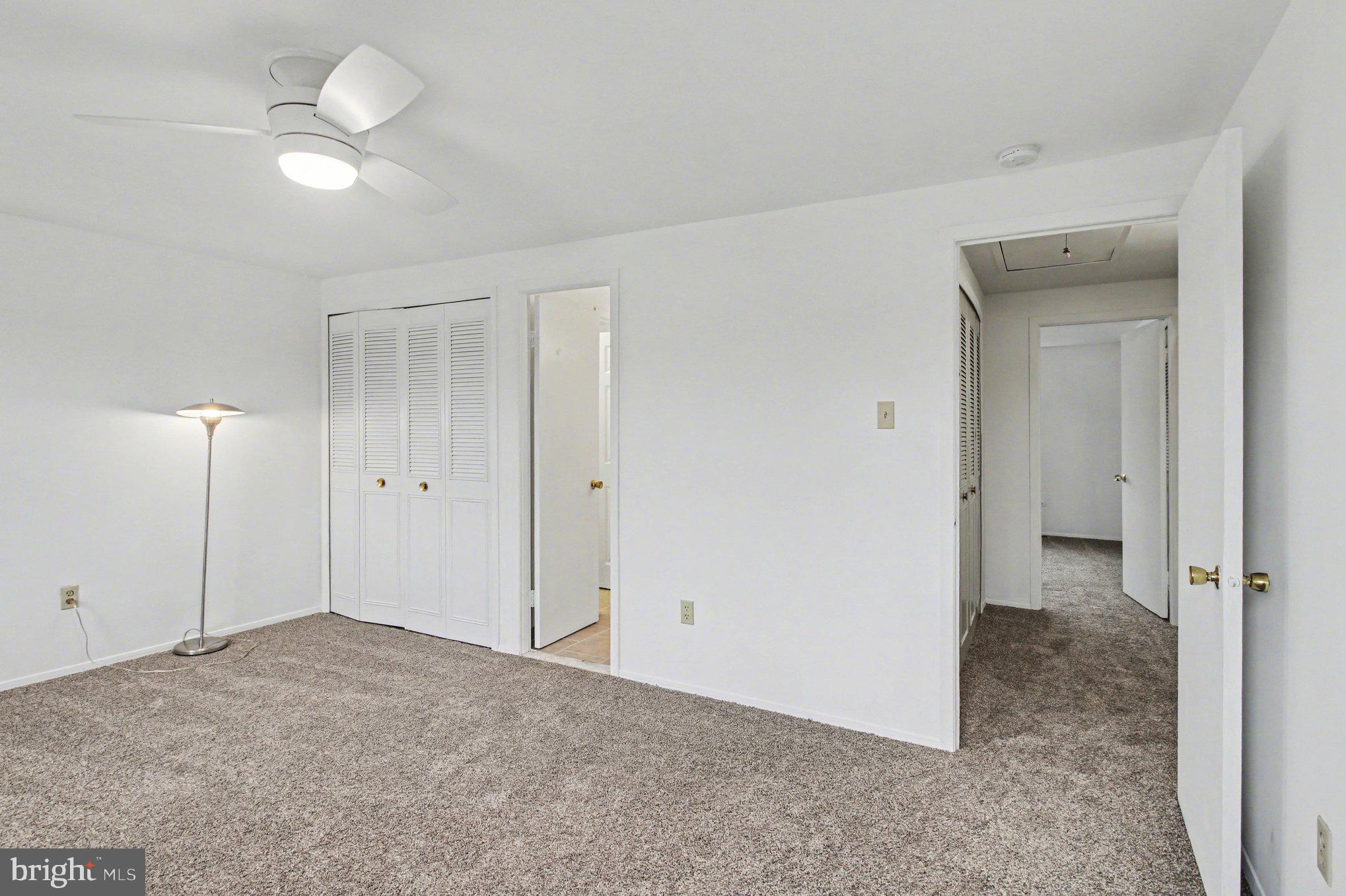 70 Rittenhouse Drive Willingboro, NJ 08046 - Photo 16 of 25 a view of a room with a ceiling fan and closet area