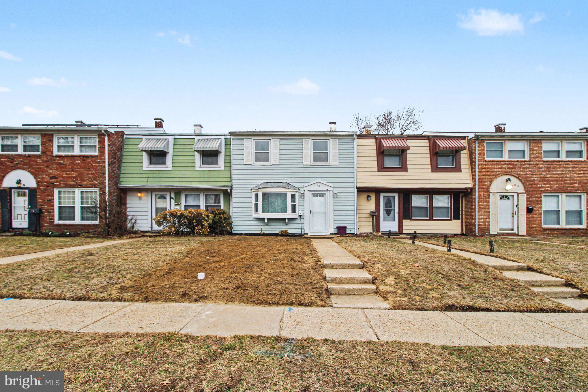 70 Rittenhouse Drive Willingboro, NJ 08046 - Photo 5 of 25 a front view of a residential apartment building with a yard