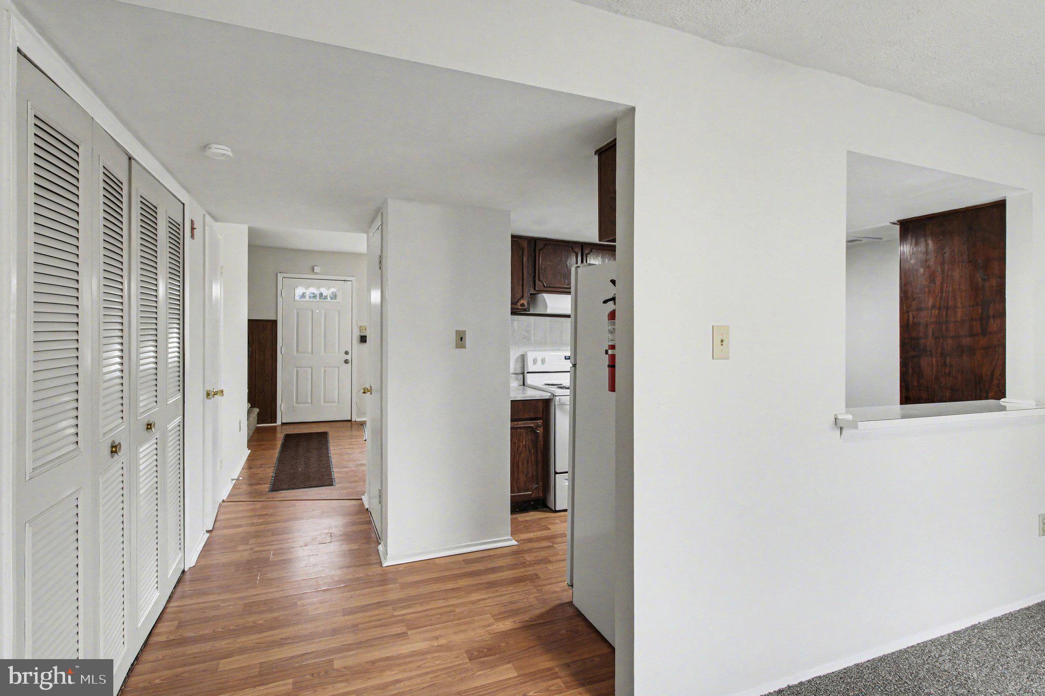 70 Rittenhouse Drive Willingboro, NJ 08046 - Photo 9 of 25 a view of a hallway with wooden floor and staircase