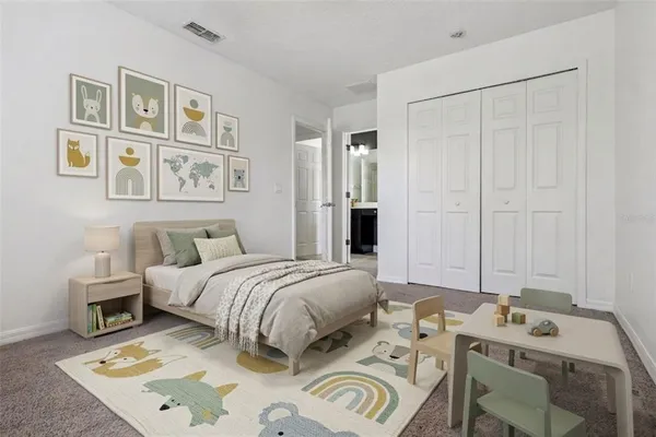 a view of a hallway with wooden floor and a living room