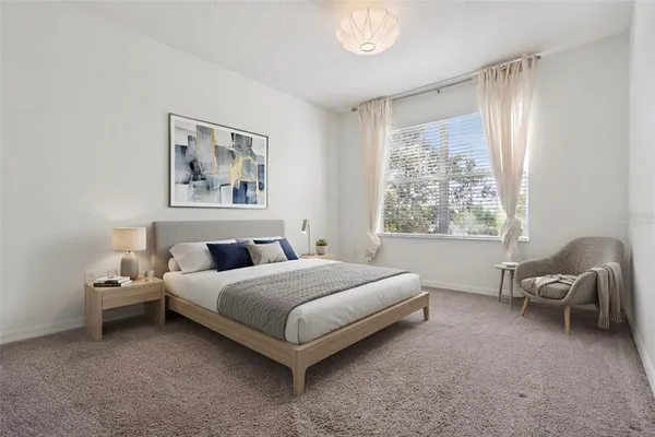 an aerial view of a house with a lake view