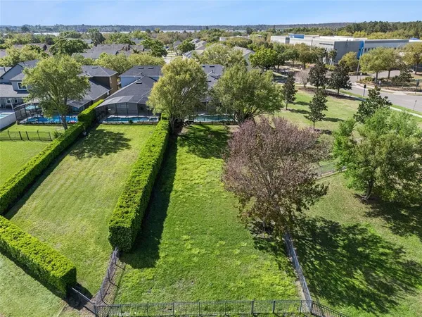 a view of a porch with a floor to ceiling window and yard