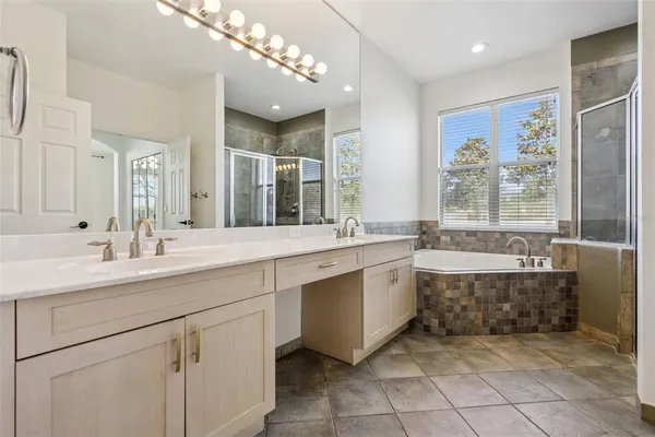 an aerial view of a house with a lake view