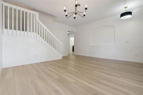 an aerial view of a house with a yard and lake view