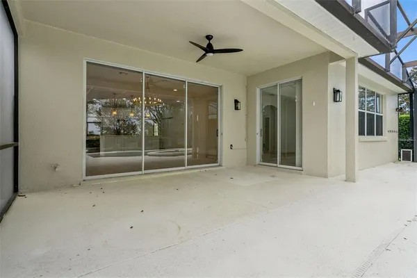 a view of a lake with boats and trees in the back