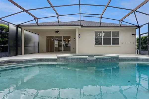a view of a garden with a building in the background