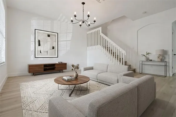 a kitchen with kitchen island white cabinets and white appliances