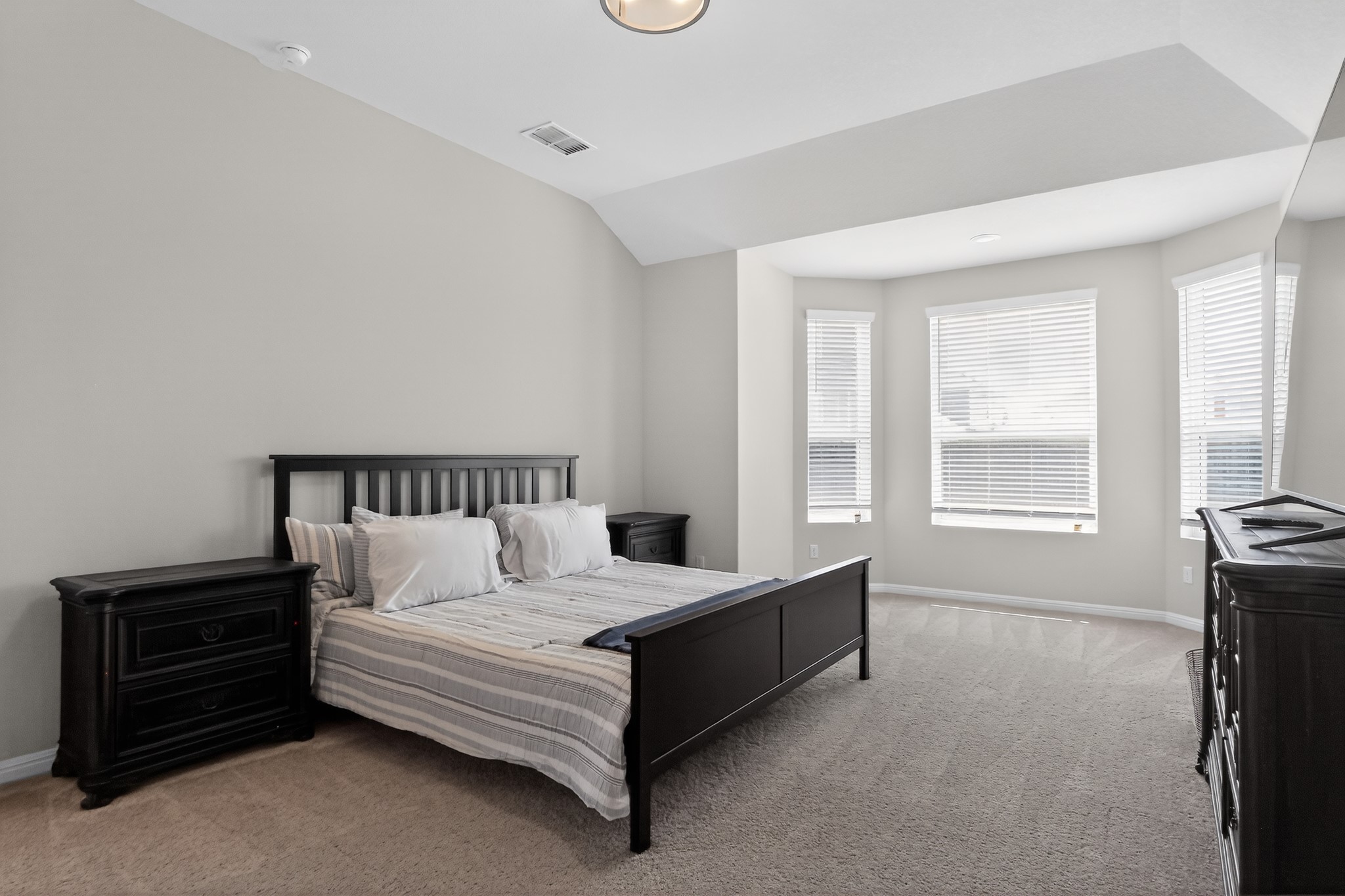 114 Bosco Road Hutto, TX 78634 - Photo 26 of 39 A quiet bedroom retreat with bay windows, offering ample natural illumination and a comfortable atmosphere.